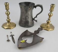 A collection of Antique metalware, to include a pair of brass candlesticks, an iron stand with