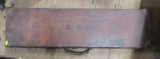 A rectangular leather covered gun case