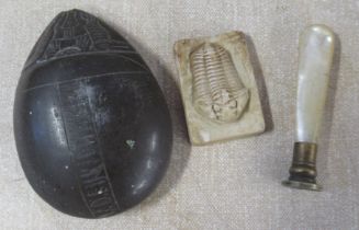 A fossil, a seal and an Egyptian item