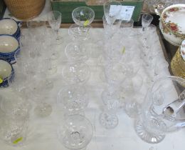 A suite of glass including water jug, wine glasses, tumblers, sherry glasses etc