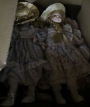 Three boxes of assorted dolls