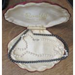 A simulated pearl necklace, boxed and another bead necklace