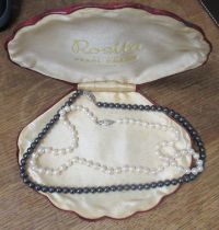 A simulated pearl necklace, boxed and another bead necklace