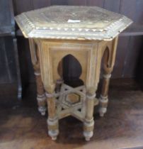 An Eastern design octagonal table width 18ins, height 20ins