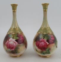 A pair of Royal Worcester vases, decorated with roses by Lander and Hood, shape number H103,
