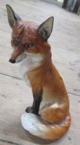 A Royal Worcester model, of a seated fox