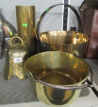 A collection of brass, to include a shell case, two jam pans and a bell