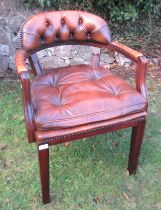 An open armchair, with deep buttoned back, trade only