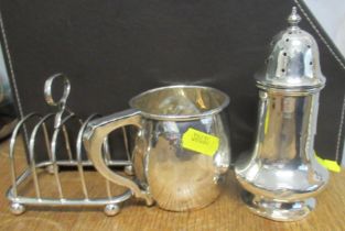 A silver toast rack, silver mug and a silver caster, weight 8oz