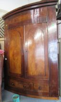 A Georgian mahogany barrel front corner cupboard, width 36ins