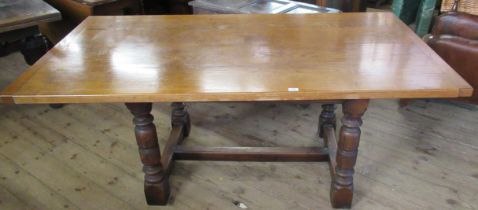 An oak dining table, width 38ins, length 72ins, height 31ins