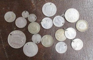A collection of silver coloured coinage