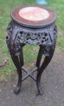 An Eastern hardwood jardiniere stand, with marble inset