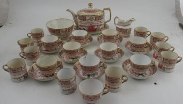 An early 19th century English porcelain, possible Spode tea and coffee service, decorated in colours