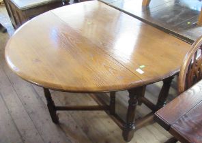 An oak gate leg table, width 46ins