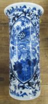 An Oriental cylindrical vase, decorated in blue and white, character marks to base, height 6ins