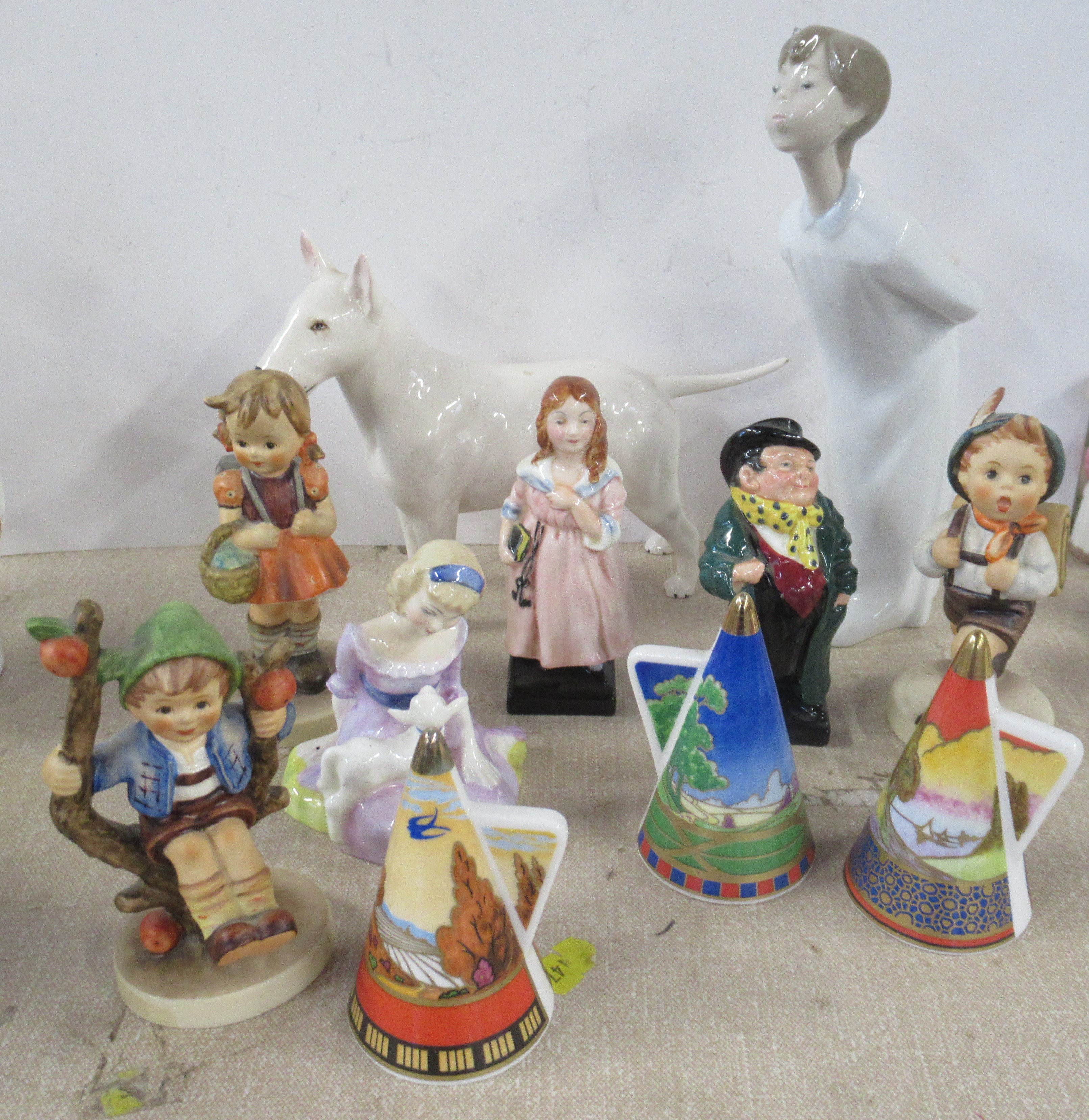 A collection of porcelain figures, to include Goebels, Royal Doulton, Lladro and three Royal