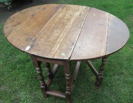 An antique oak gate leg table 36ins x 42ins height 28ins