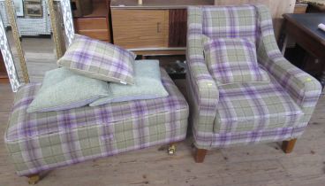 A tartan upholstered modern armchair, together with matching pouffe with hinged top and cushions -