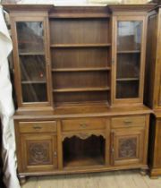 An oak dresser, with plate rack flanked by glazed doors over cupboards below, width 63ins, height