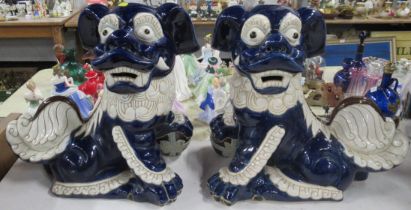 A pair of pottery dogs of fo, height 17ins