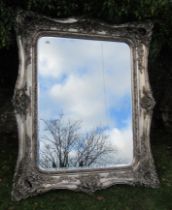 A large modern mirror, with ornate painted frame, total height 55ins, total width 65ins