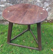 An antique oak cricket table diameter 26.5ins, height 24.5ins