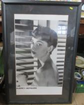 A framed Audrey Hepburn poster, 30ins x 18ins