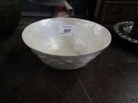 A white bowl with embossed decoration