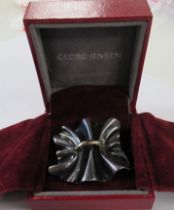 A Georg Jensen Danish silver brooch, stamped, design no 399, in Georg Jensen box