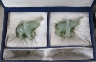 A pair of green agate elephants, height 3.25ins, in a fitted case (30139)