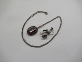 A silver necklace, with paste stone pendant, together with matching earrings