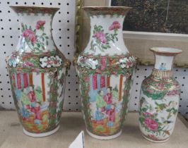 A pair of Cantonese vases, height 10ins, together with a smaller example Condition Report: One of