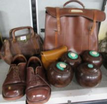 A set of four Crown Green bowls, together with shoes, cleaning kit, Slazenger bag and a mini