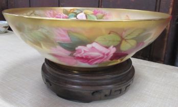 A Royal Worcester bowl, the interior and exterior decorated with roses, diameter 9ins