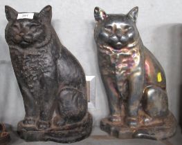 Two metal cat door stops and a metal key rack