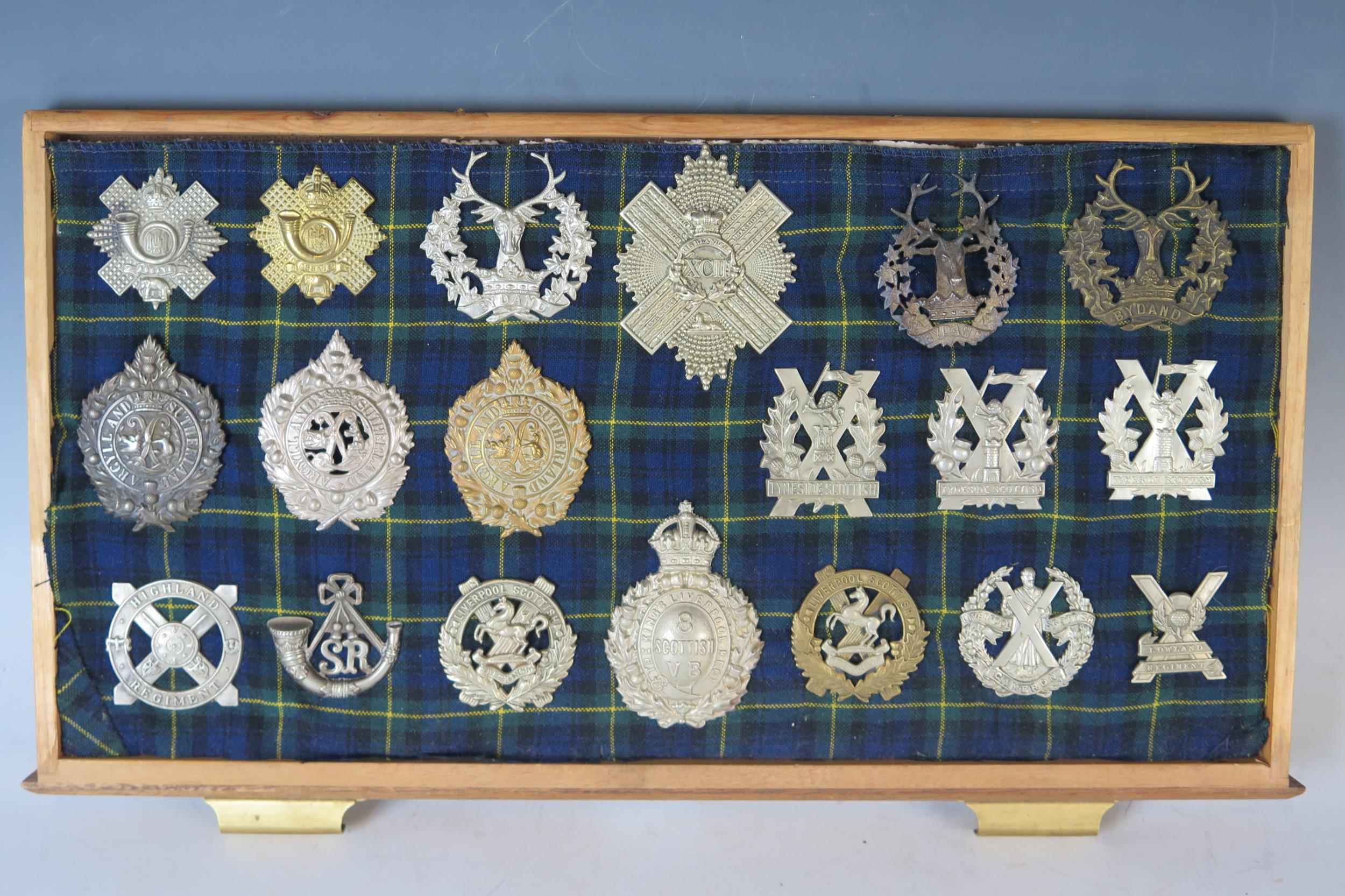 Collection of Military Helmet and Cap Badges including Gordon Highlanders, Tyneside Scottish,