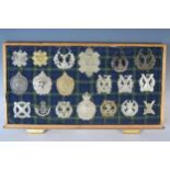 Collection of Military Helmet and Cap Badges including Gordon Highlanders, Tyneside Scottish,