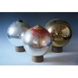 A set of three silvered witches balls, 26cm diameter. (3).