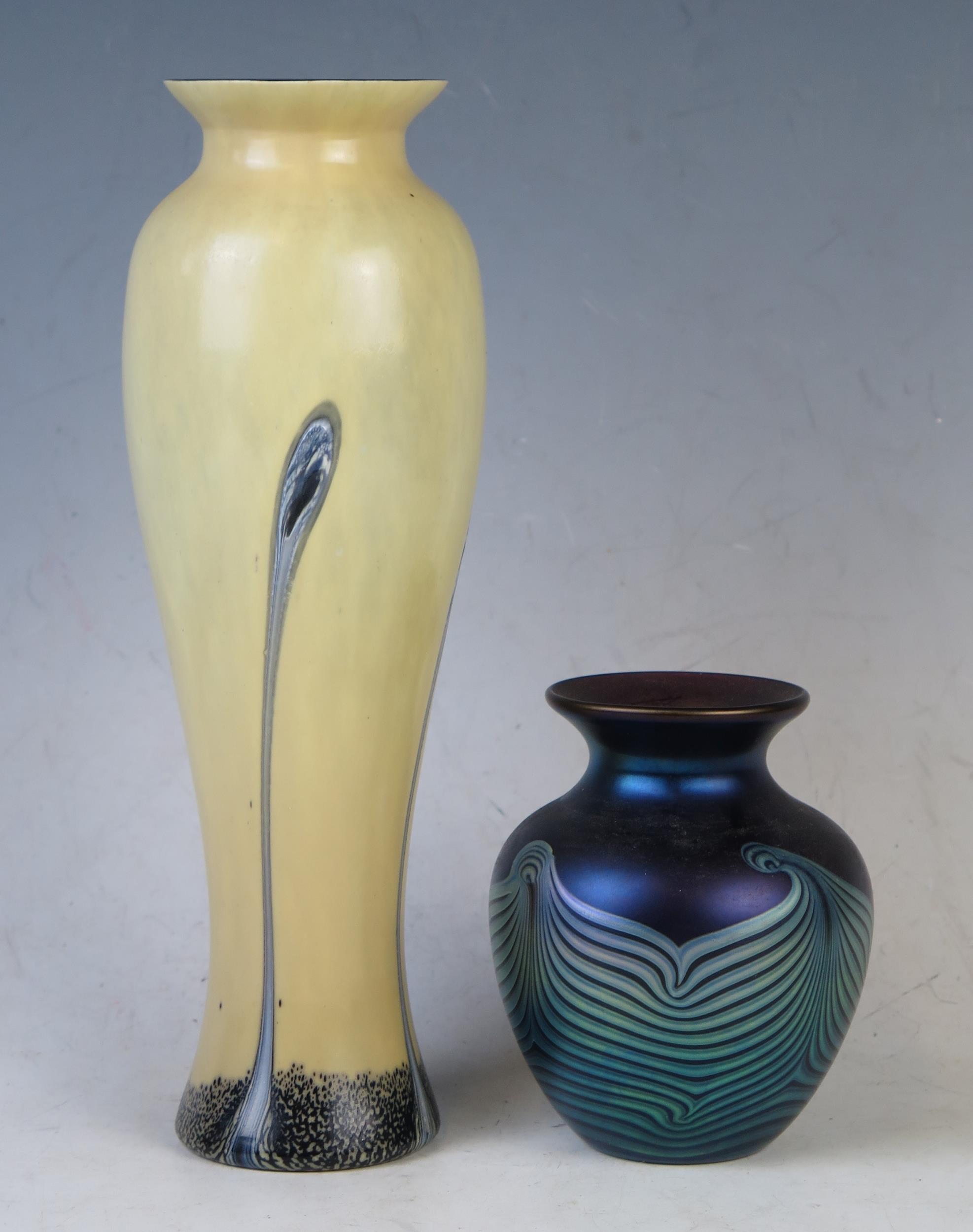 A Caithness glass vase of Art Nouveau influence of ovoid form with sinuous lines to an ivory ground,