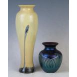 A Caithness glass vase of Art Nouveau influence of ovoid form with sinuous lines to an ivory ground,