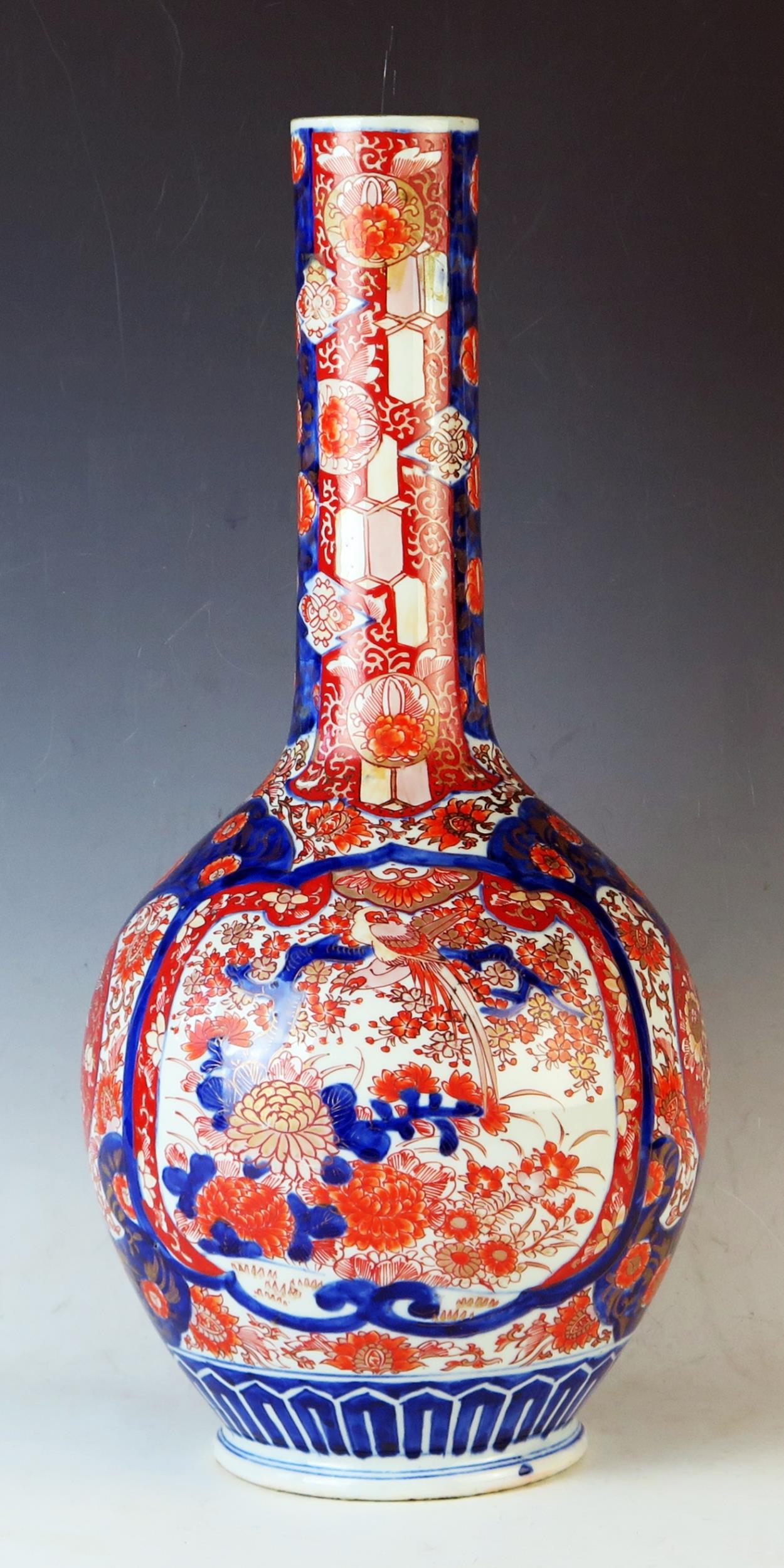 Japanese Meiji Period Imari vase of bottle form, decorated with garden scenes, 51cm 20 1/4inches.