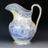 A 19th century pottery jug with blue and white transfer print decoration. 26cm Spout cracked and