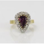 Armandine Garnet? and Diamond Pear Shaped Ring in an unmarked high carat gold setting, 14.2x11mm