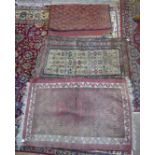 An early 20th Century Kilim Rug, possibly Greek, the wine red field with all over lozenge medallions