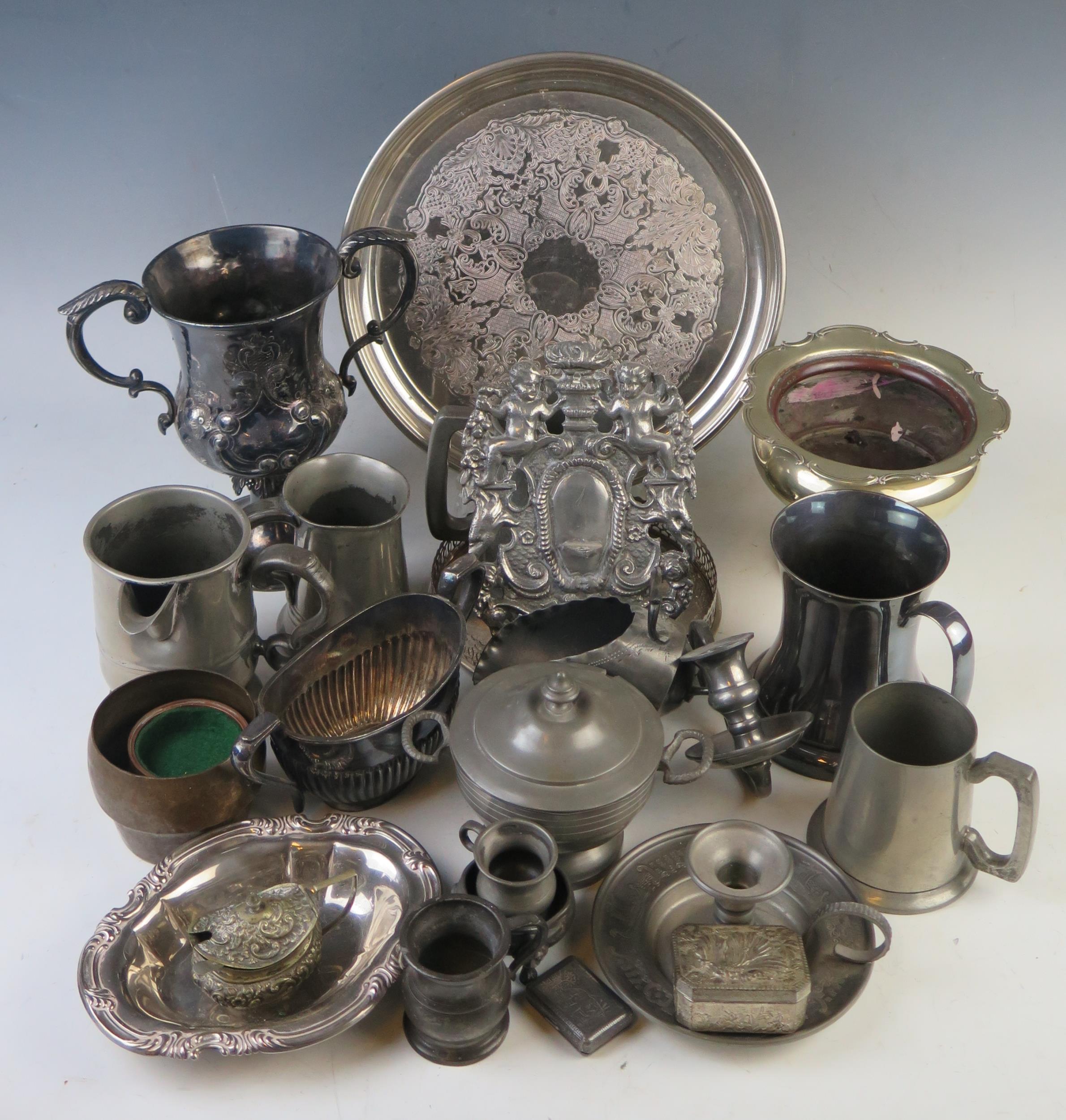 A collection of assorted plated and pewter wares including; trophy cup, salver, sugar basin, mugs