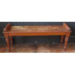 A late 19th Century oak window/ hall bench, raised on turned tapering legs, 51x121x34cm.