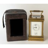 A late 19th century French brass carriage clock, with 8cm Roman dial with subsidiary alarm dial, the
