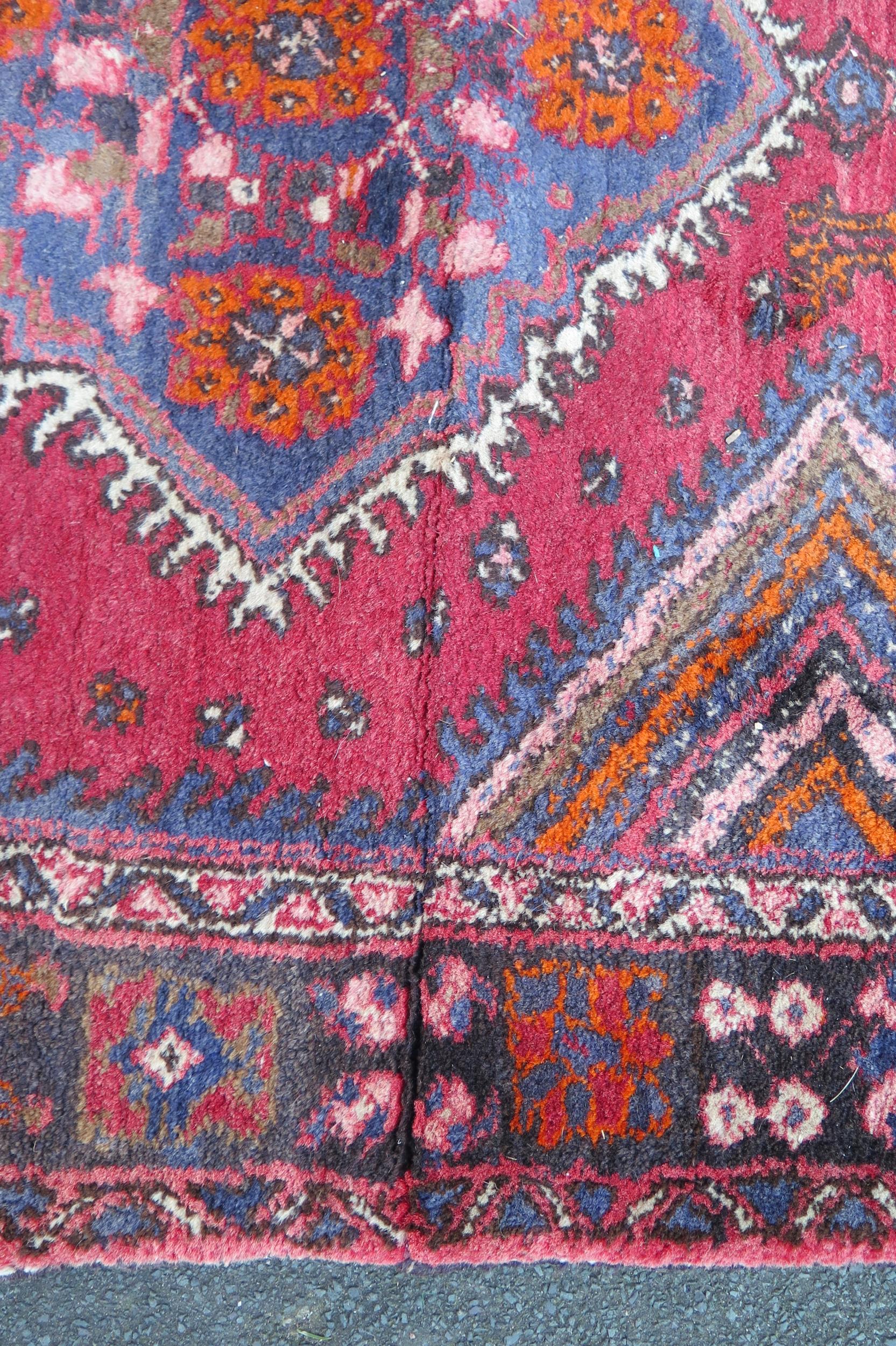 A large 20th Century Turkish Runner, wool carpet, geometric diamond lozenges, red ground, pyramid - Image 4 of 7