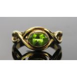 Peridot Dress Ring in an unmarked gold setting, size O.5, 4.8g